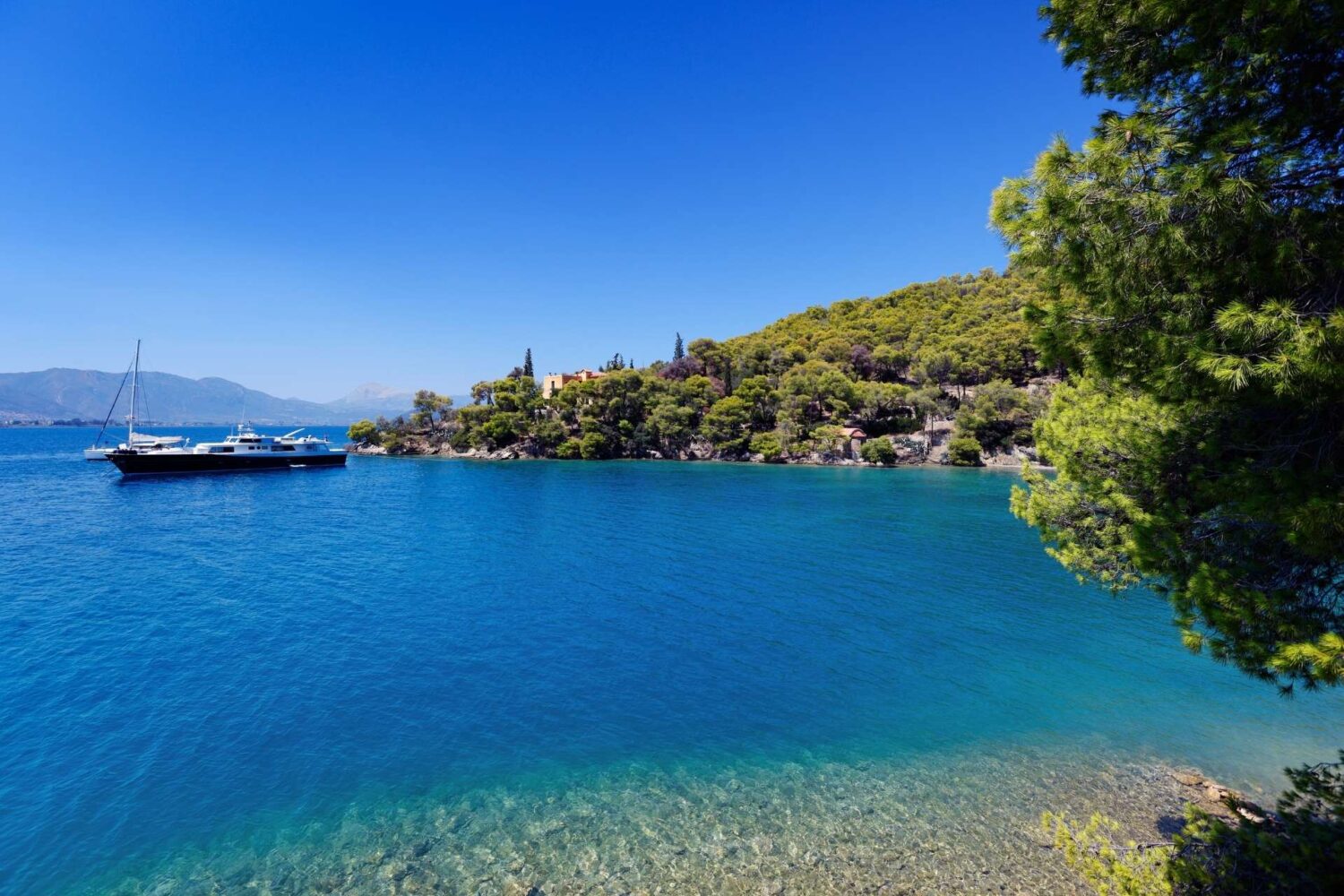 Poros bay with yachts at anchor